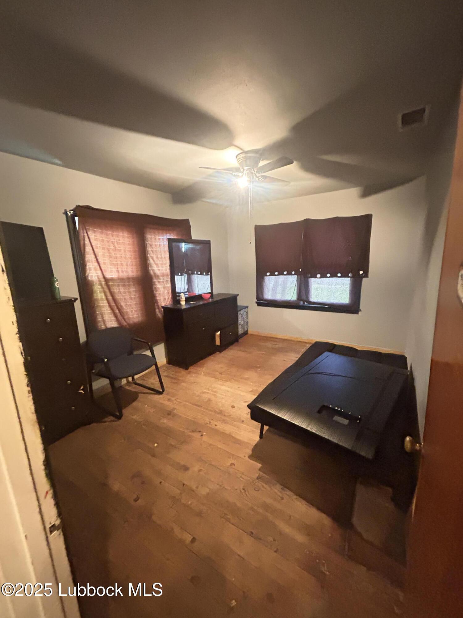2712 37th Street Lubbock, TX 79413 - Photo 7 of 12 a room with furniture and a flat screen tv