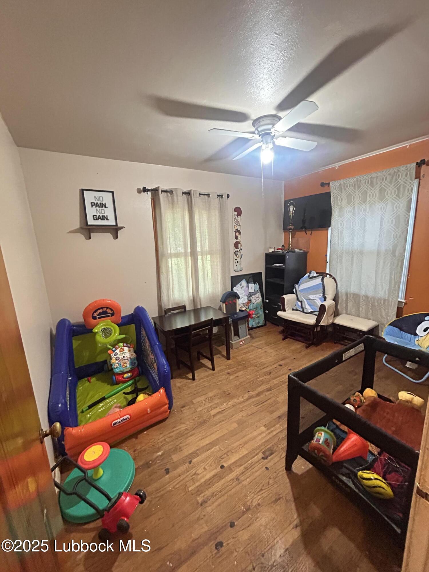 2712 37th Street Lubbock, TX 79413 - Photo 10 of 12 a living room with furniture and a dining table