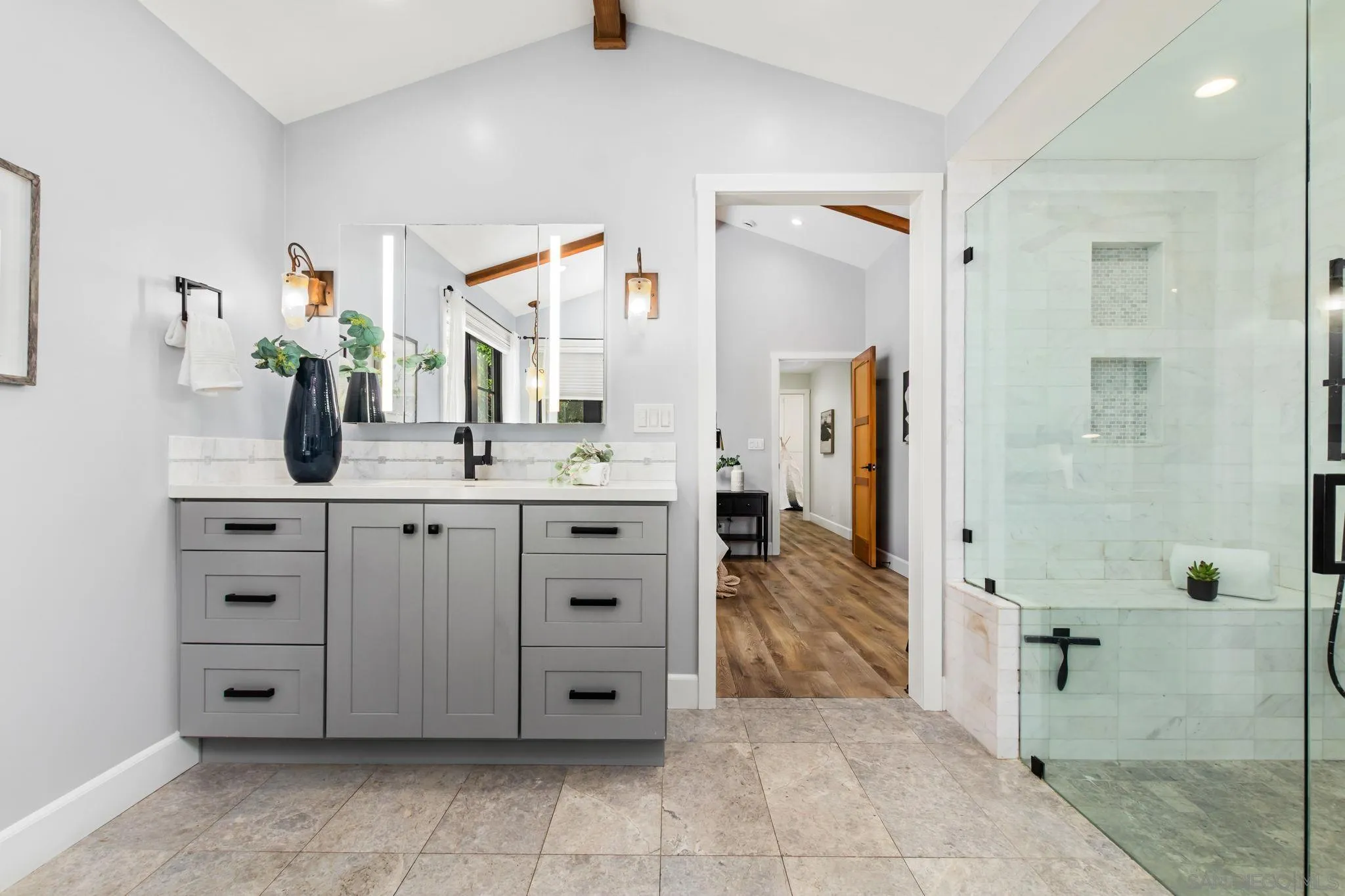 2335 Ivy Road Oceanside, CA 92054 - Photo 25 of 53 a bathroom with a sink vanity and mirror