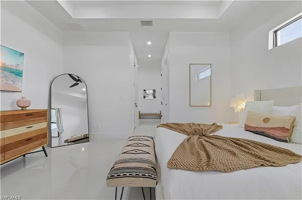 a bedroom with bed and walk in closet