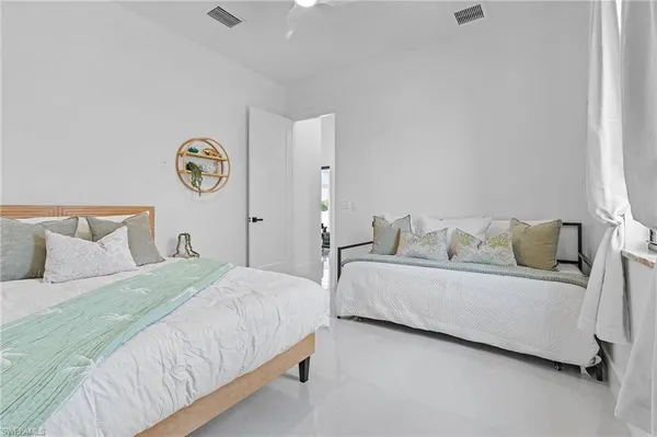 a bed room with a bed and a couch