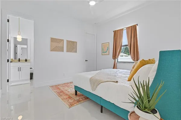 a bedroom with a bed and a couch