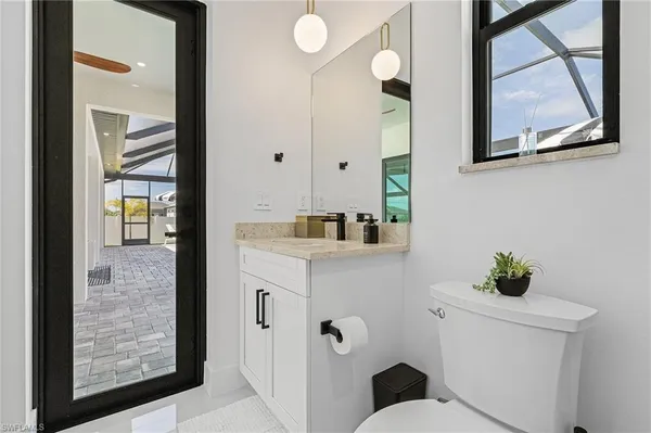 a view of a backyard with garden and patio