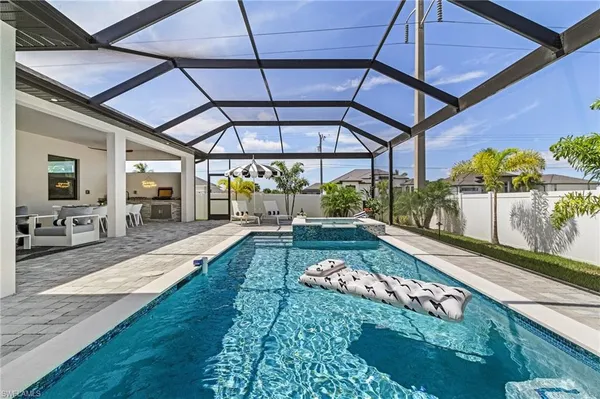 a view of a porch with furniture and a yard