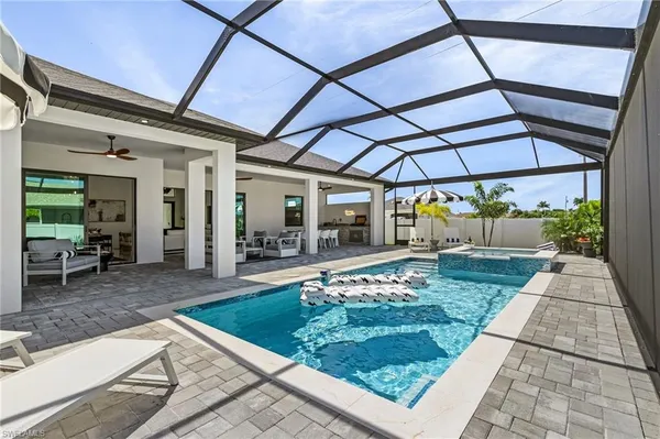a view of a patio with chairs and tables
