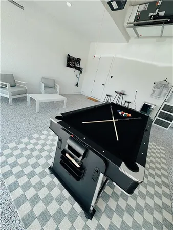 a utility room with multiple dryer and washer