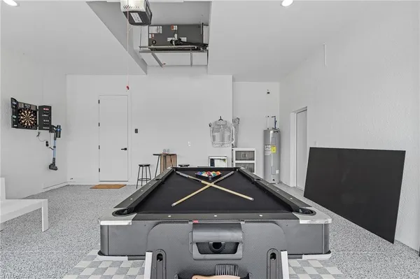 an aerial view of residential houses with city view