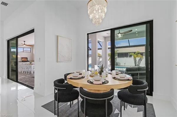 a dining room with furniture and window