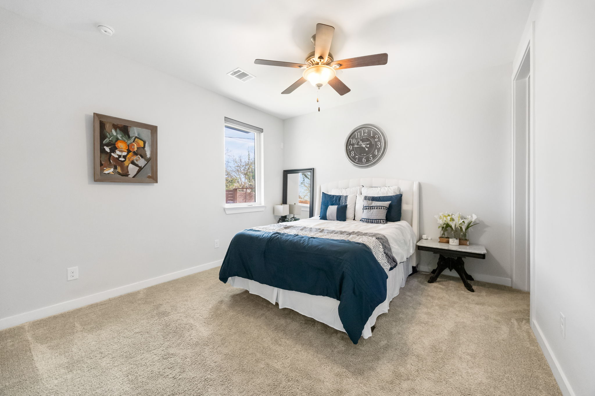 1417 Kramer Lane, Unit 14 Austin, TX 78758 - Photo 5 of 33 Bedroom with light carpet and a ceiling fan