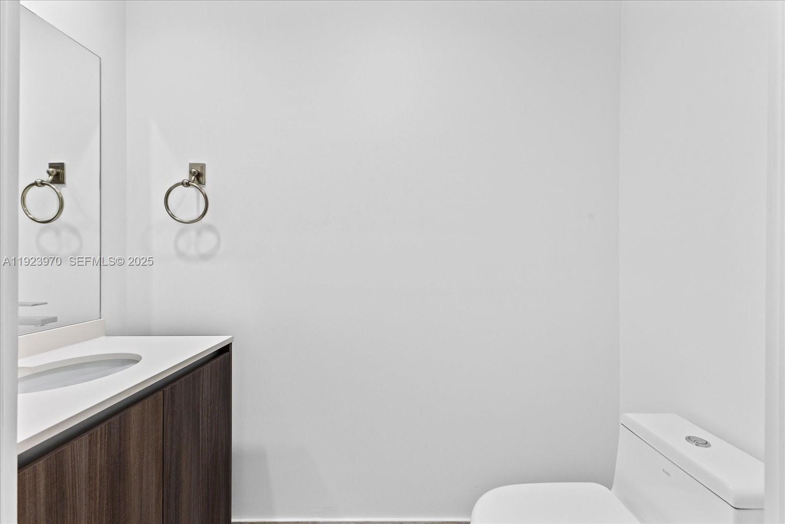 488 Northeast 18th Street, Unit 4102 Miami, FL 33132 - Photo 11 of 60 a bathroom with a sink and a toilet