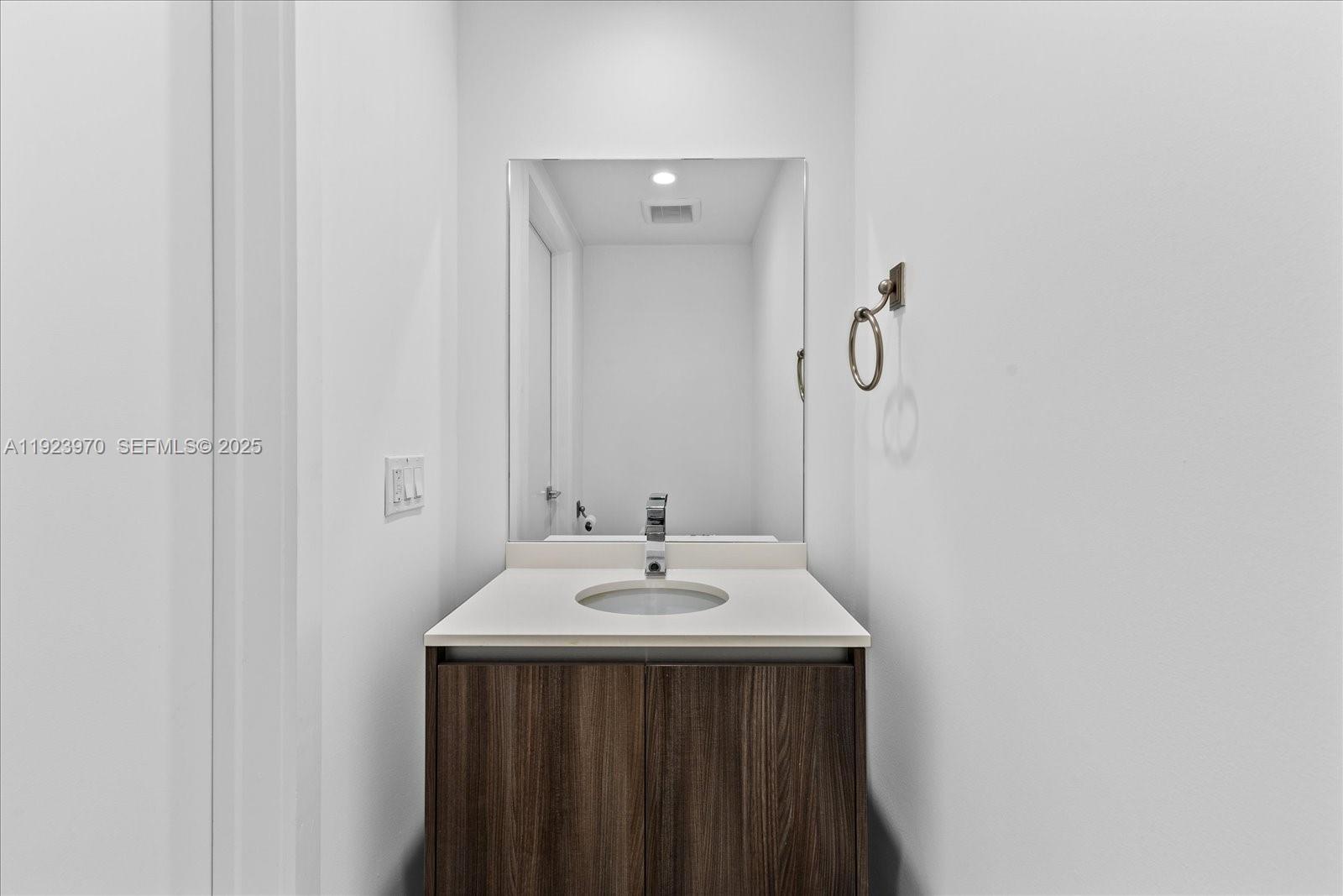 488 Northeast 18th Street, Unit 4102 Miami, FL 33132 - Photo 12 of 60 a bathroom with a sink and a mirror