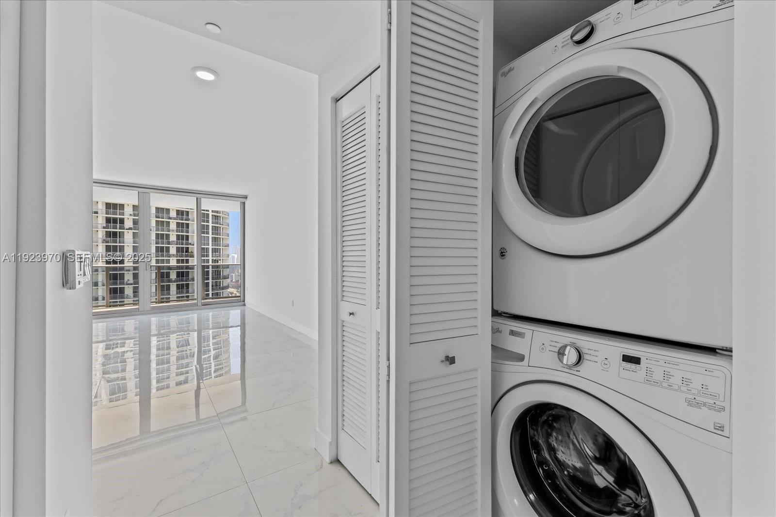 488 Northeast 18th Street, Unit 4102 Miami, FL 33132 - Photo 13 of 60 a view of a hallway with washer and dryer