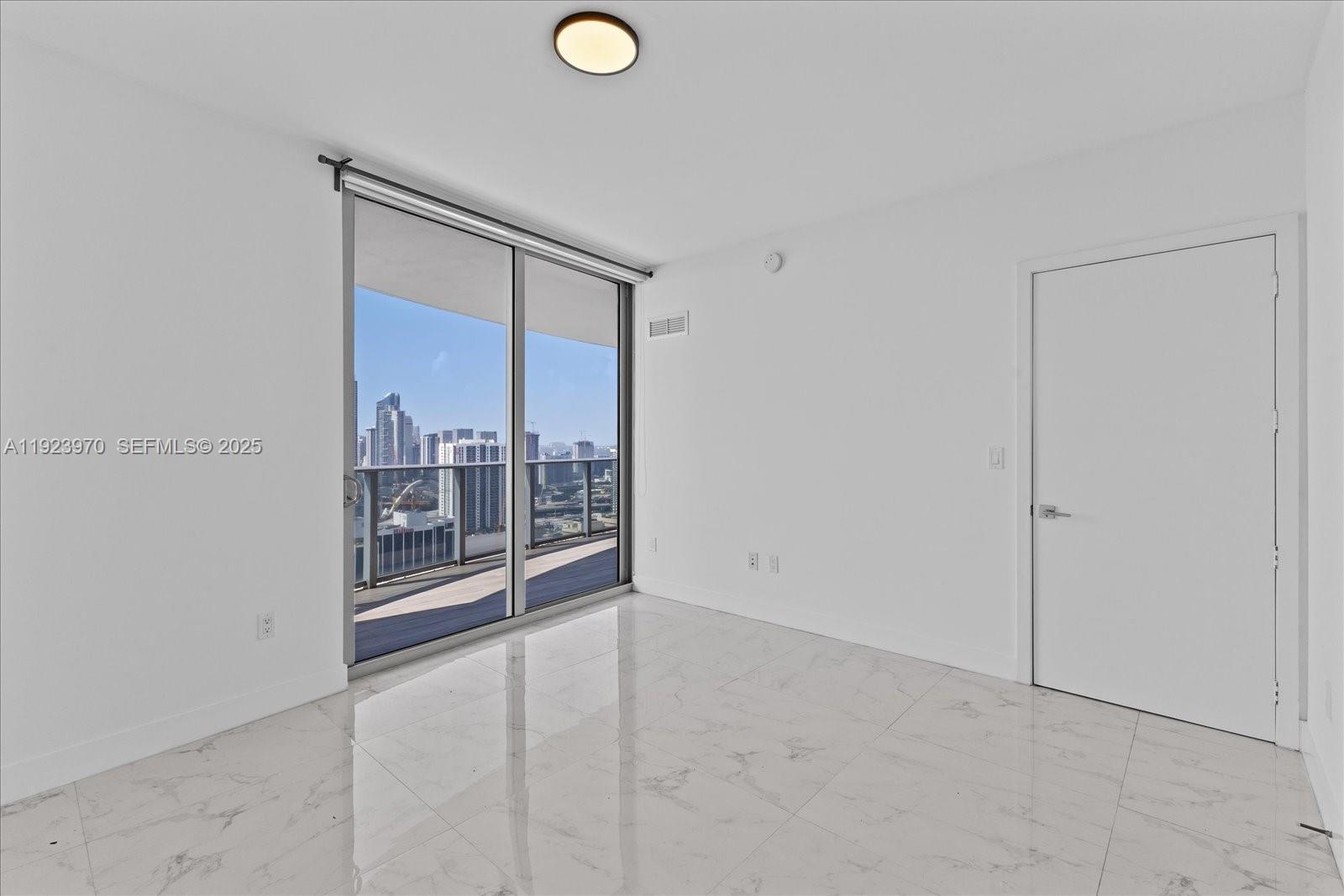 488 Northeast 18th Street, Unit 4102 Miami, FL 33132 - Photo 17 of 60 a view of a room with racks on the wall