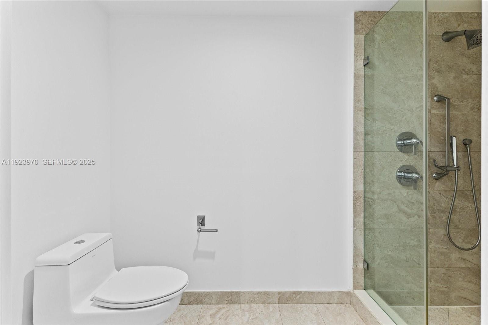 488 Northeast 18th Street, Unit 4102 Miami, FL 33132 - Photo 19 of 60 a white toilet sitting next to a bathroom sink