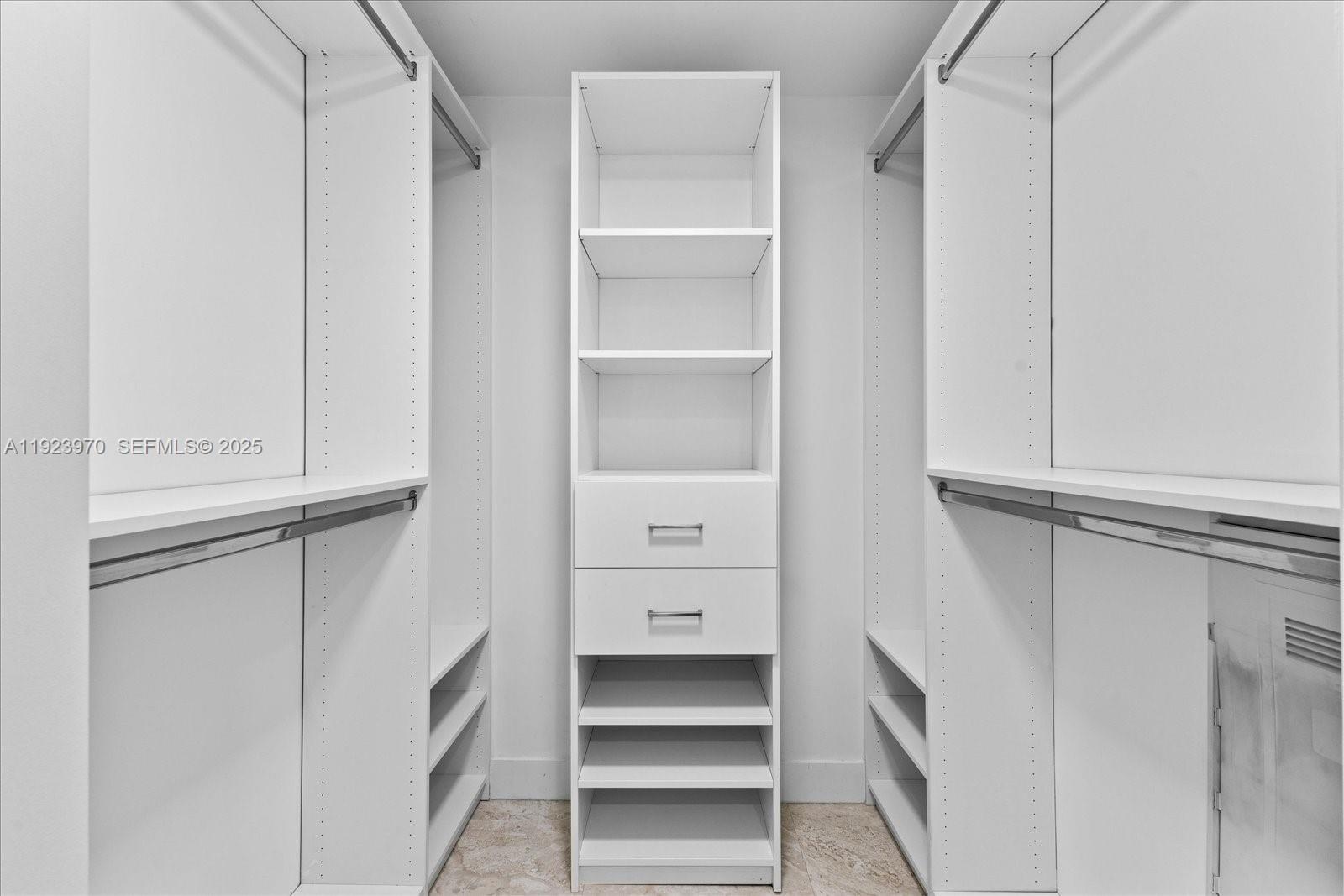 488 Northeast 18th Street, Unit 4102 Miami, FL 33132 - Photo 20 of 60 a view of walk in closet with empty racks