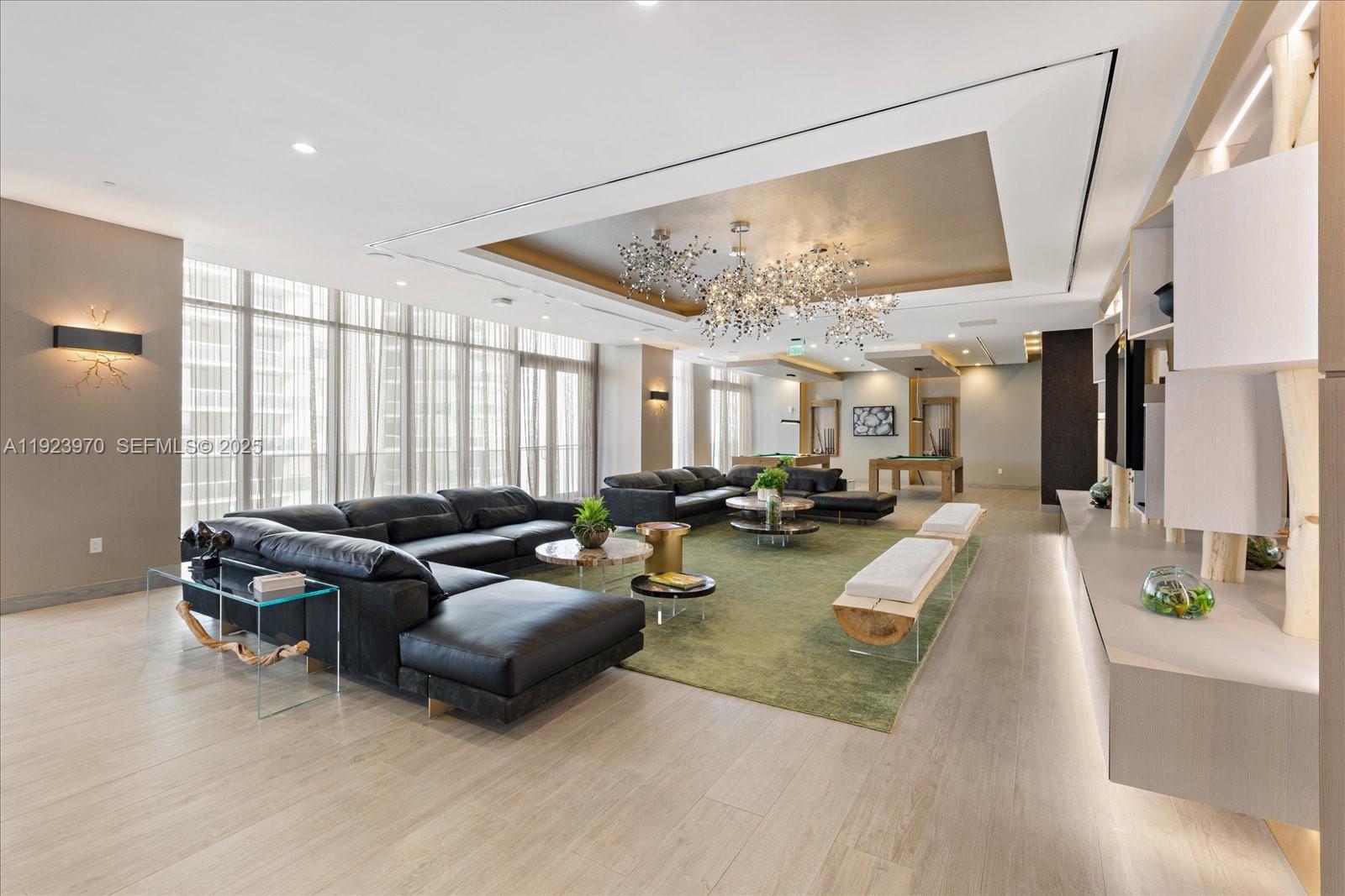 488 Northeast 18th Street, Unit 4102 Miami, FL 33132 - Photo 22 of 60 a living room with furniture and a large window