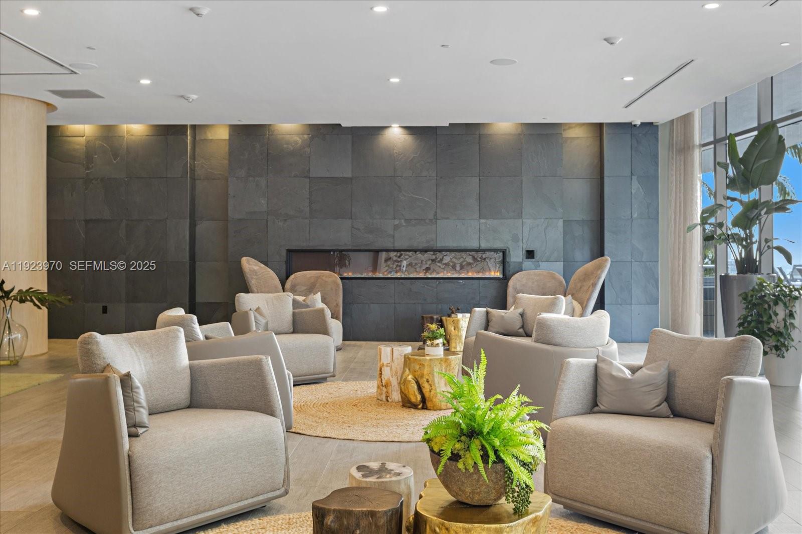 488 Northeast 18th Street, Unit 4102 Miami, FL 33132 - Photo 28 of 60 a living room with furniture and a flat screen tv