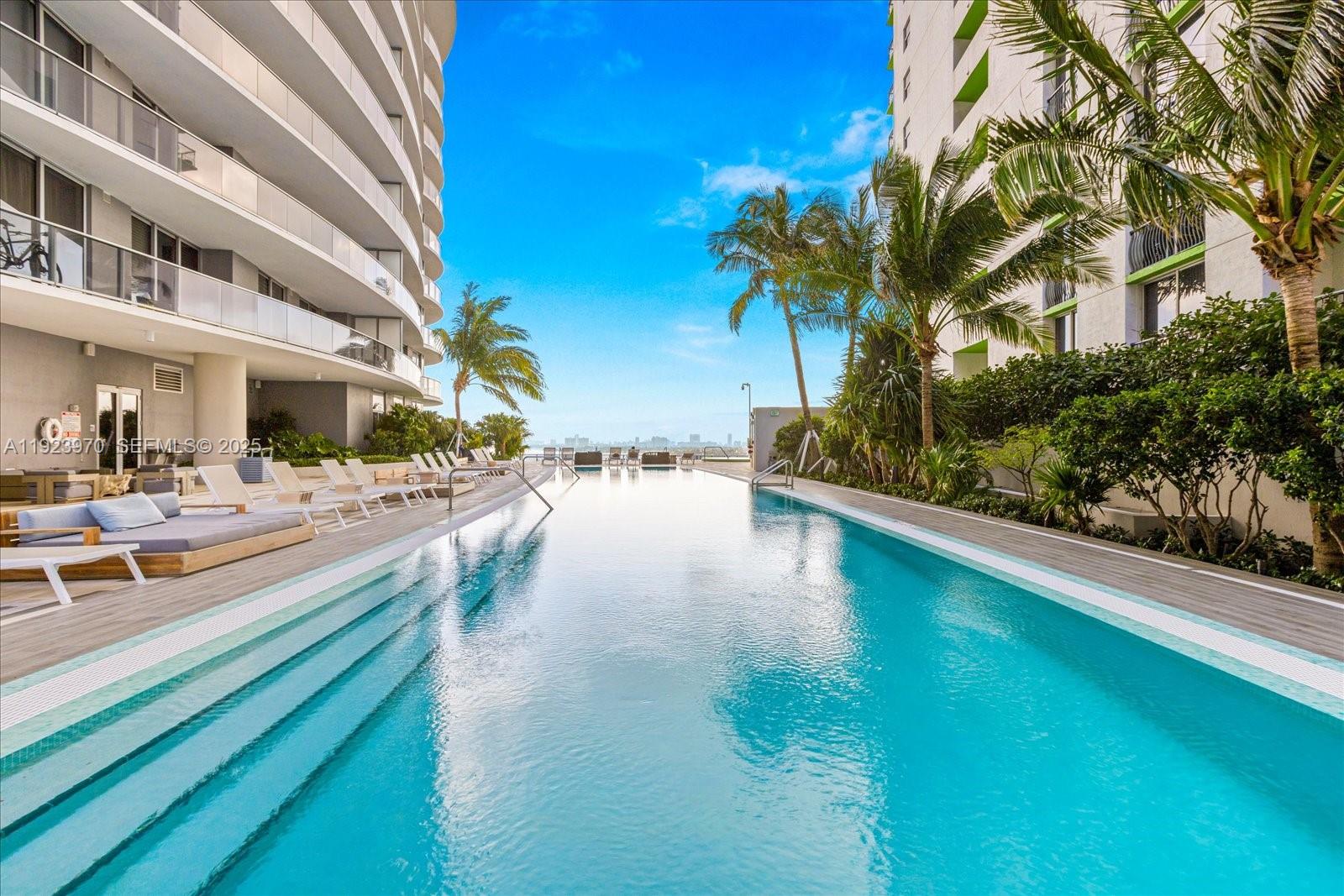 488 Northeast 18th Street, Unit 4102 Miami, FL 33132 - Photo 32 of 60 a view of swimming pool with outdoor seating