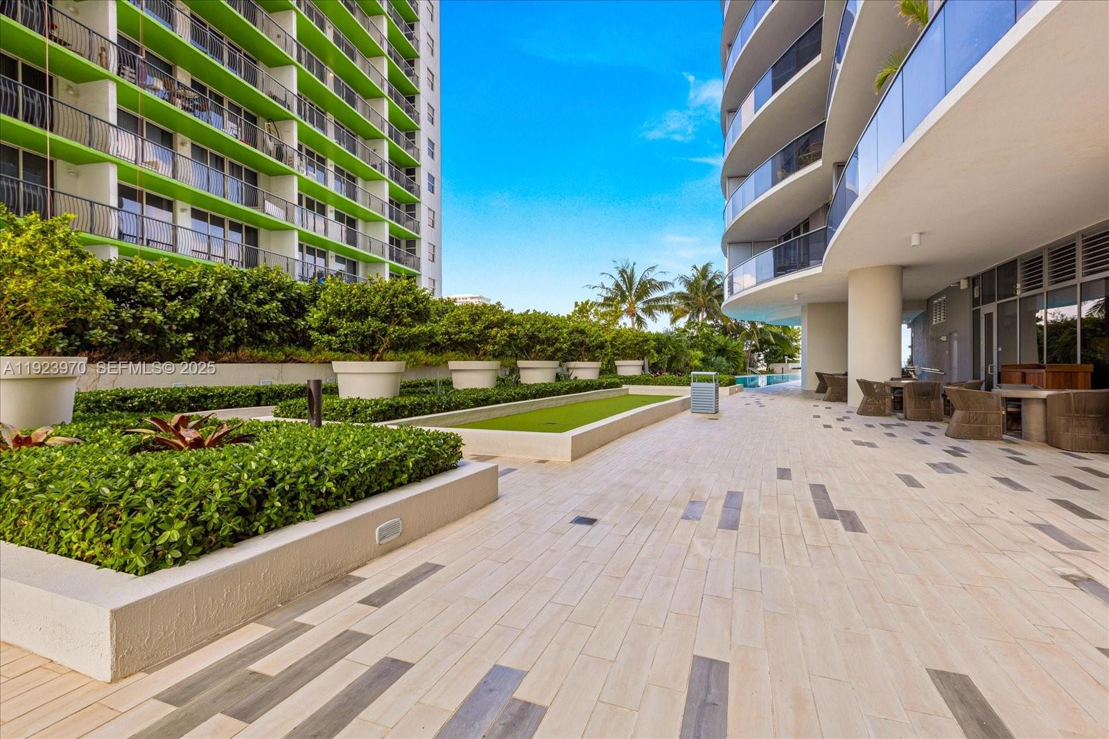 488 Northeast 18th Street, Unit 4102 Miami, FL 33132 - Photo 34 of 60 a view of a garden with a building