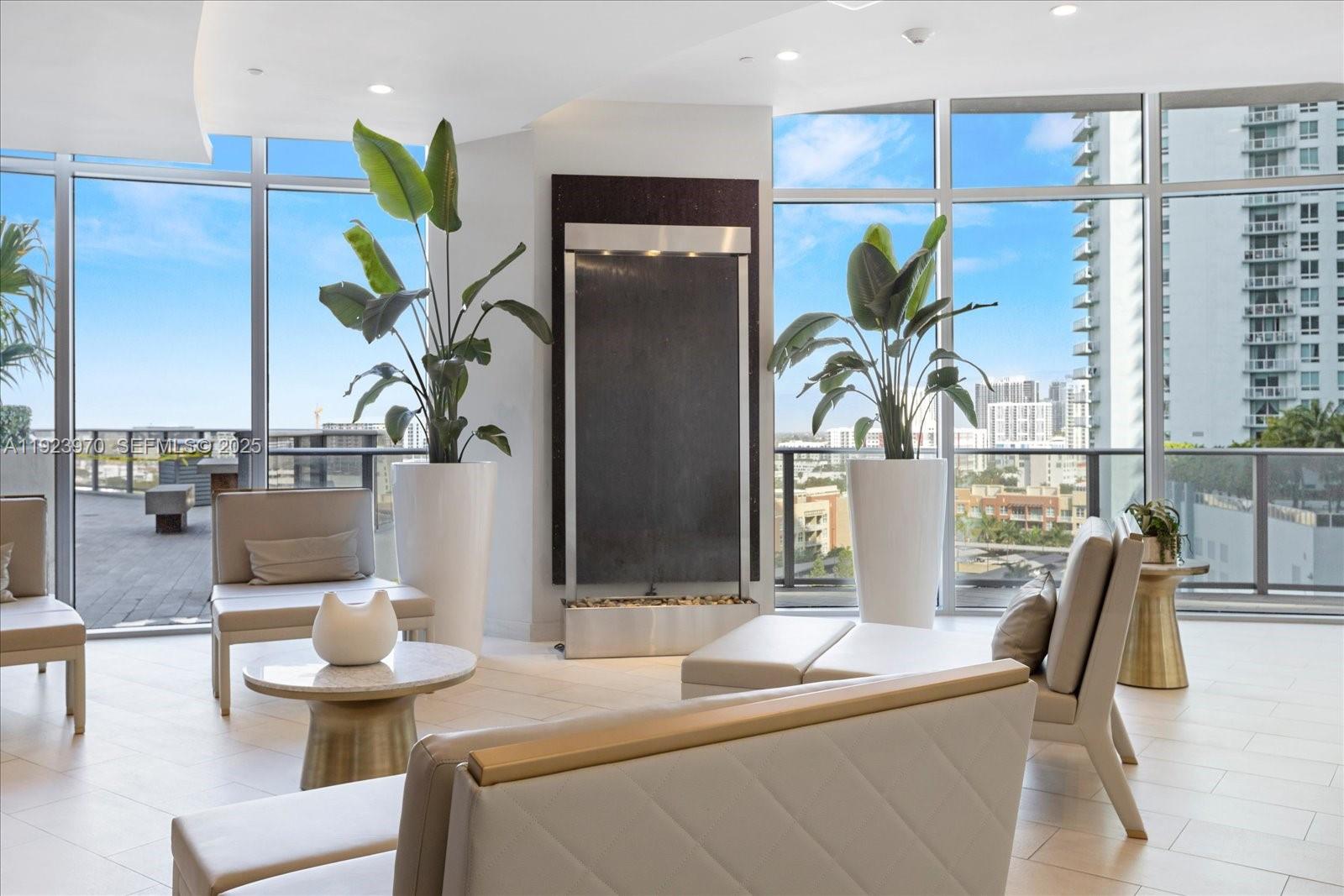 488 Northeast 18th Street, Unit 4102 Miami, FL 33132 - Photo 37 of 60 a living room with furniture and a potted plant