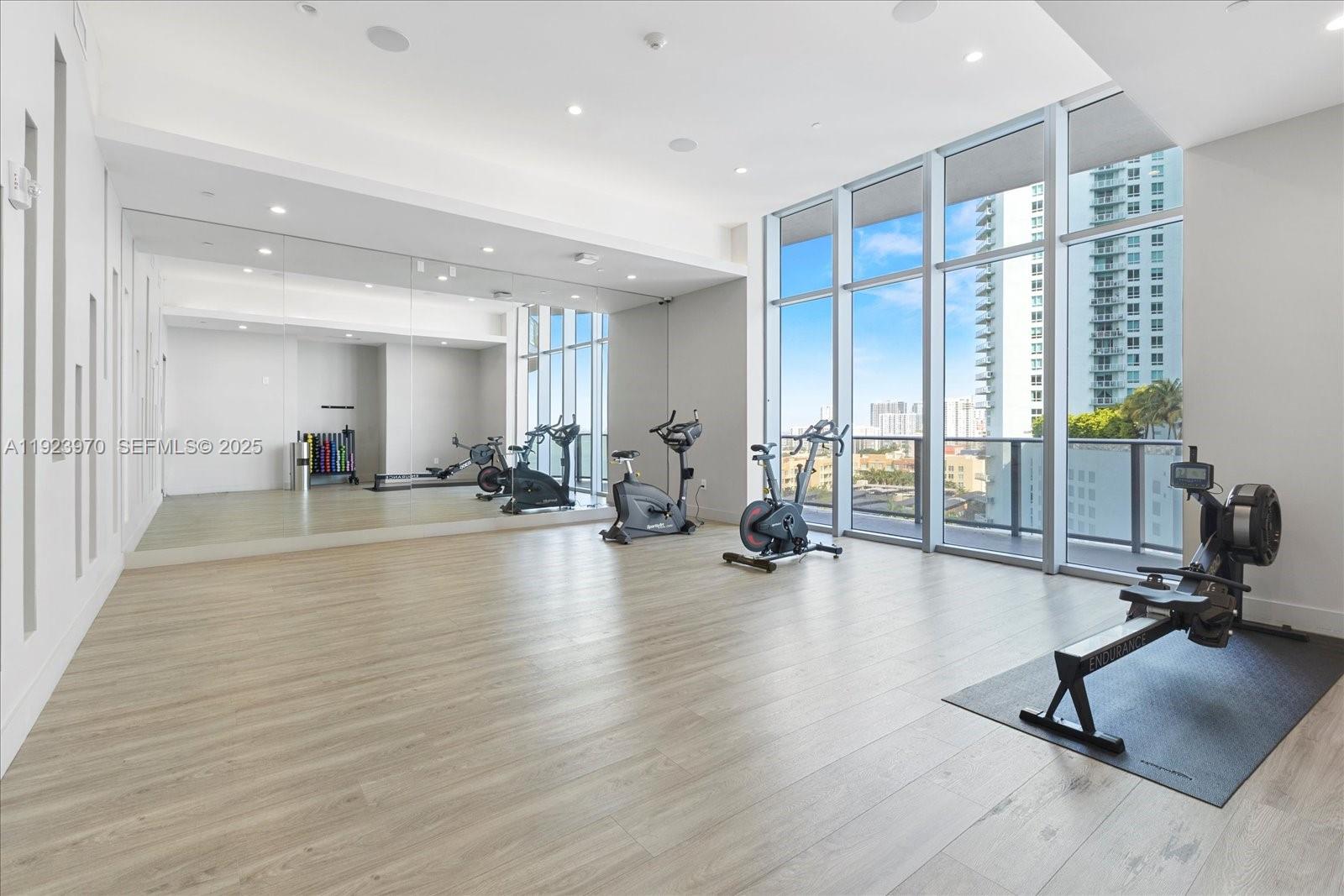 488 Northeast 18th Street, Unit 4102 Miami, FL 33132 - Photo 41 of 60 a view of a room with gym equipment