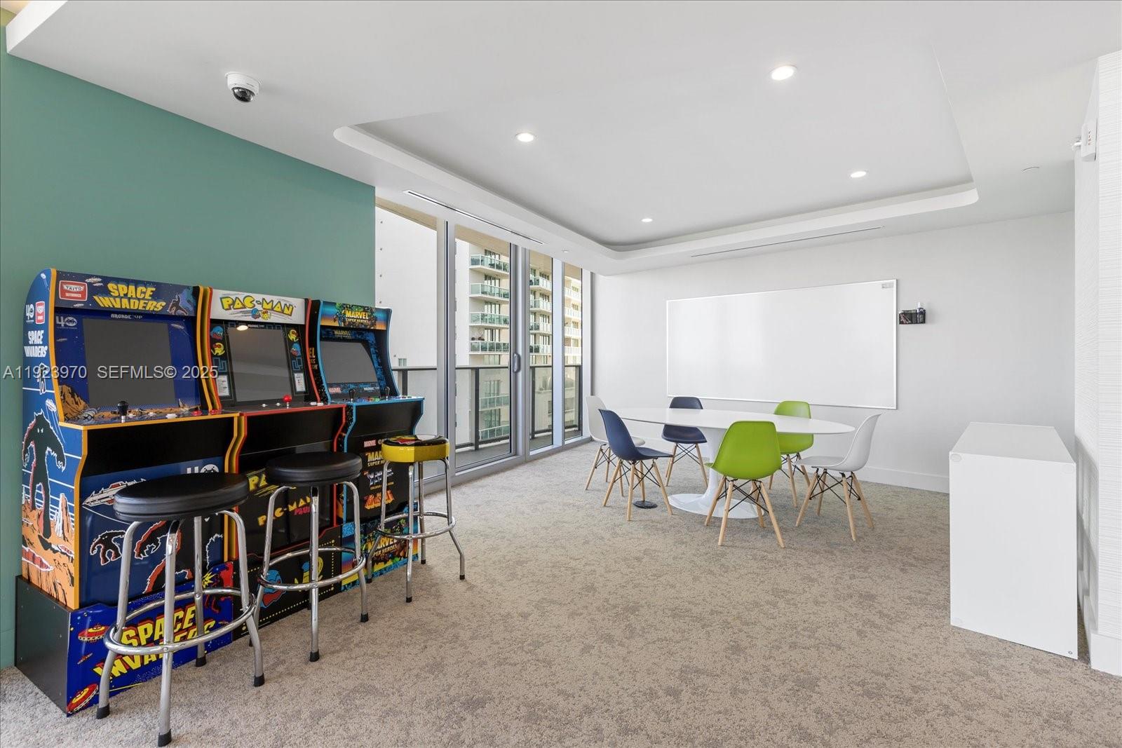 488 Northeast 18th Street, Unit 4102 Miami, FL 33132 - Photo 45 of 60 a view of a dining room with furniture and a potted plant