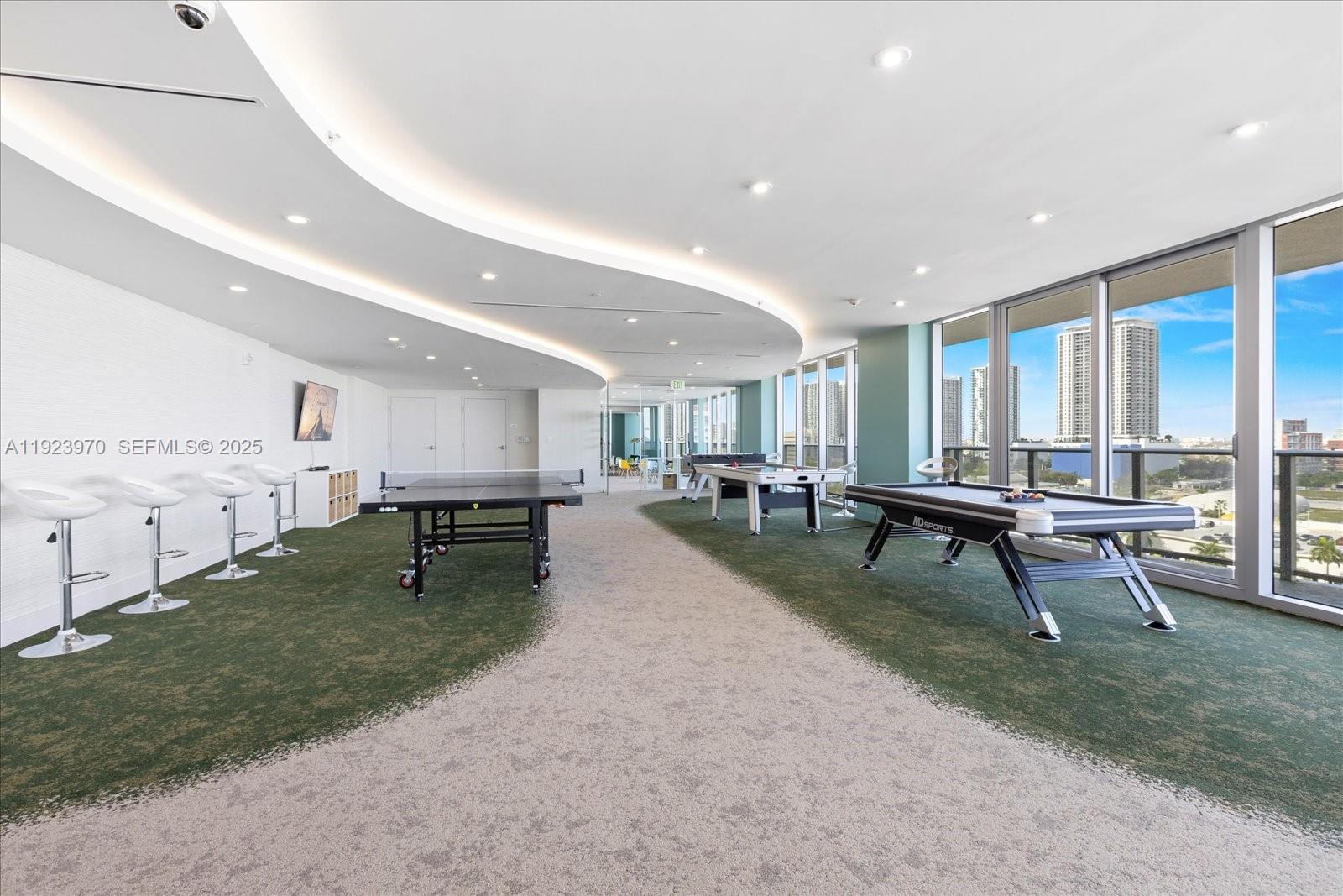 488 Northeast 18th Street, Unit 4102 Miami, FL 33132 - Photo 46 of 60 a living room with lots of furniture and a table