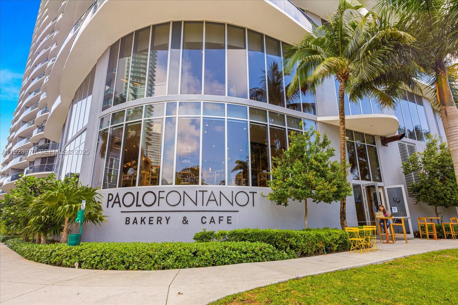 488 Northeast 18th Street, Unit 4102 Miami, FL 33132 - Photo 52 of 60 a front view of a building with a garden