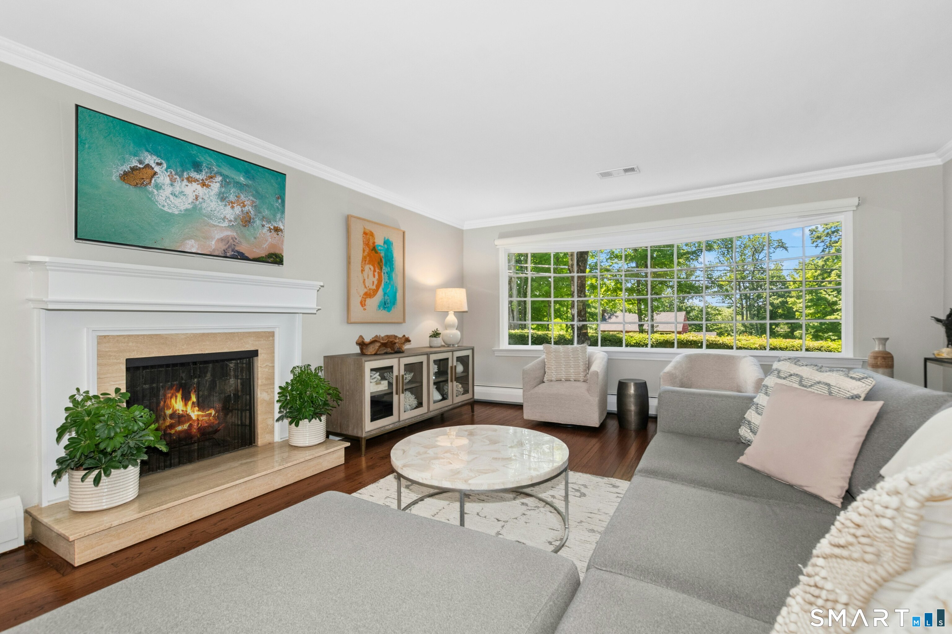 29 Old Farm Road Weston, CT 06883 - Photo 6 of 27 The living room has a beautiful, oversized bay window and an inviting wood burning fireplace and is drenched in sunlight.
