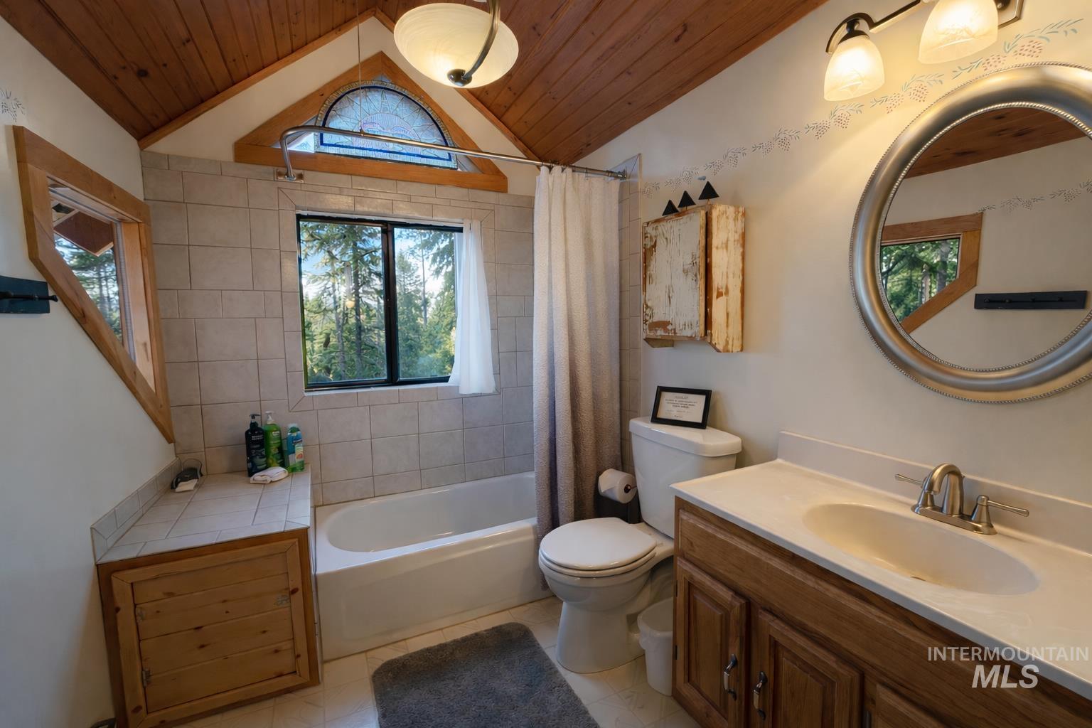 397 Warm Lake Road Cascade, ID 83611 - Photo 21 of 30 Bathroom with shower / bath combo, vanity, wood ceiling, and lofted ceiling