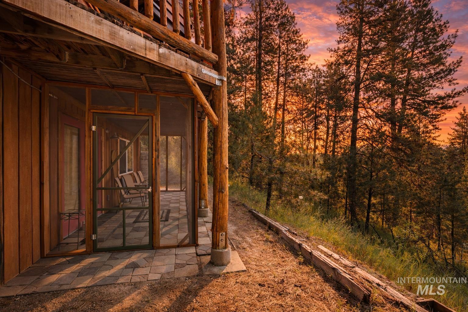 397 Warm Lake Road Cascade, ID 83611 - Photo 7 of 30 Yard at dusk featuring a sunroom