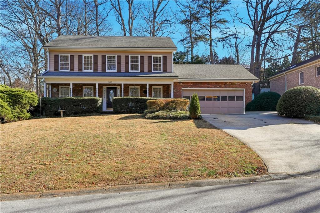 2983 Huntshire Place Atlanta, GA 30340 - Photo 1 of 1 front view of a house with a yard