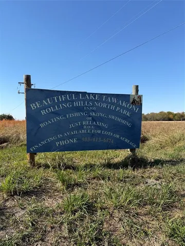 a view of outdoor space with garden and signage