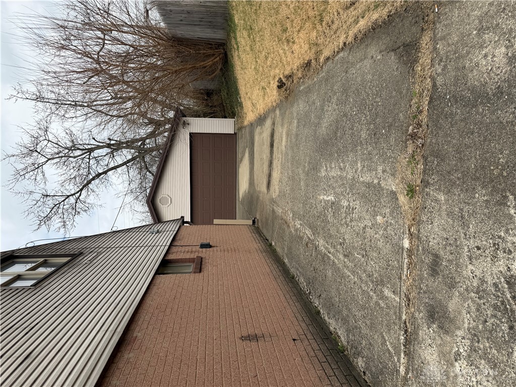 4867 Rittenhouse Drive Dayton, OH 45424 - Photo 17 of 17 This concrete driveway leads to a functional garage.