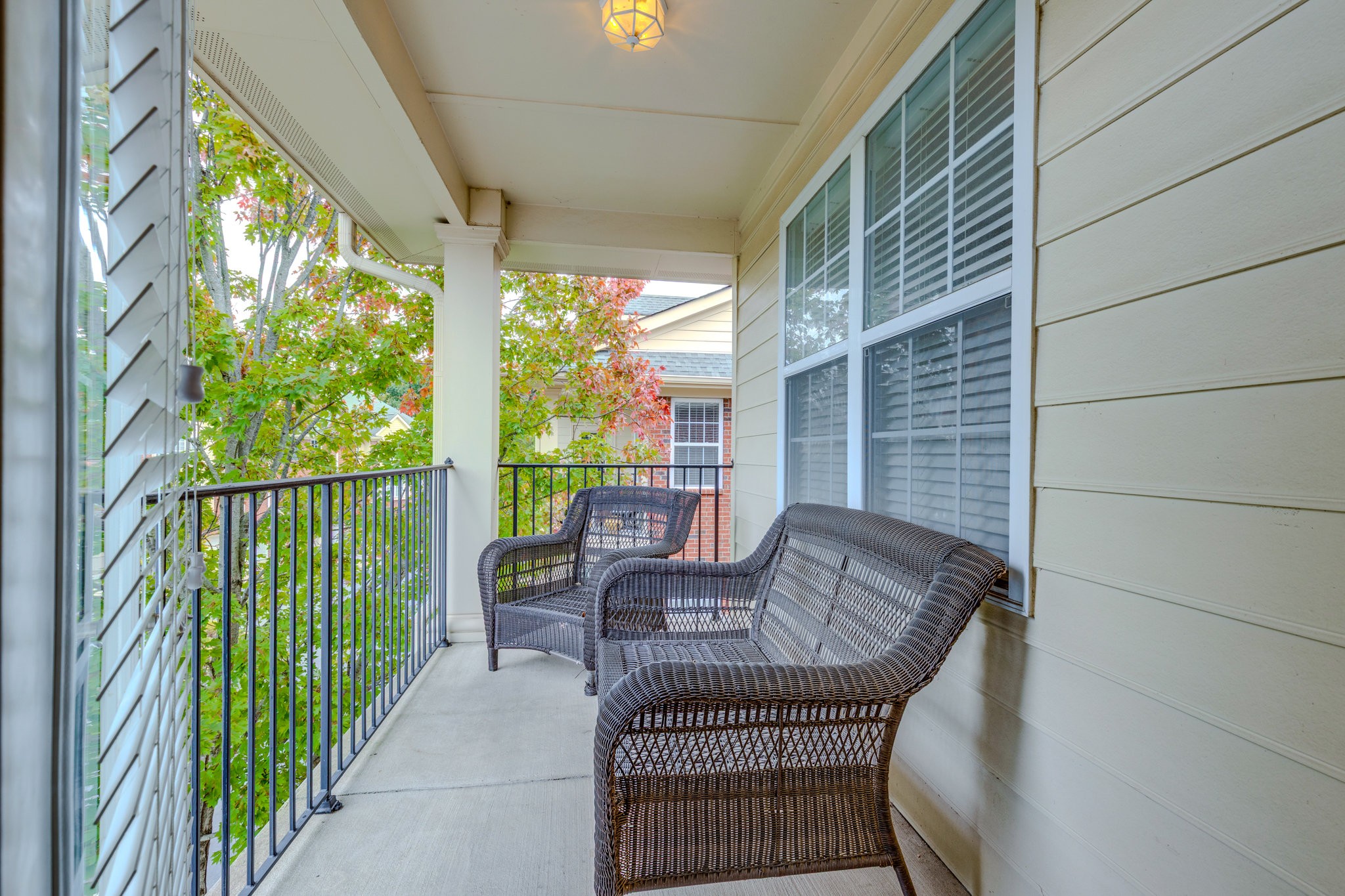 3201 Aspen Grove Drive, Unit F9 Franklin, TN 37067 - Photo 17 of 33 a balcony view with a couches and dining table with wooden floor