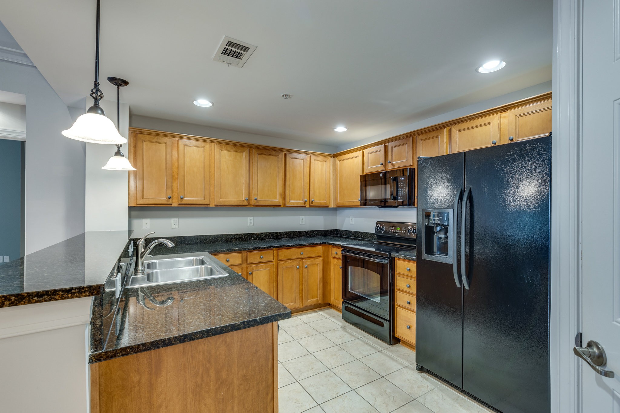 3201 Aspen Grove Drive, Unit F9 Franklin, TN 37067 - Photo 19 of 33 a kitchen with stainless steel appliances granite countertop a sink a stove and a refrigerator