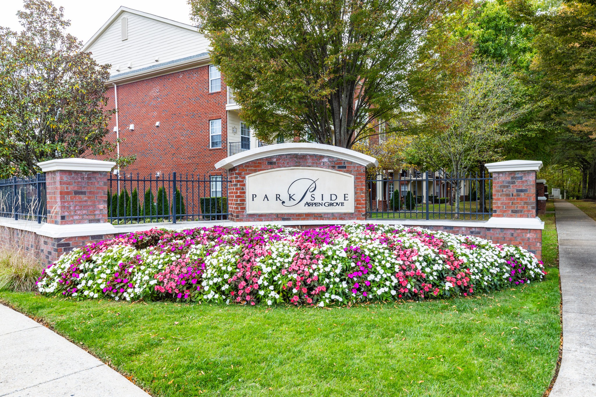 3201 Aspen Grove Drive, Unit F9 Franklin, TN 37067 - Photo 2 of 33 a front view of a house with garden