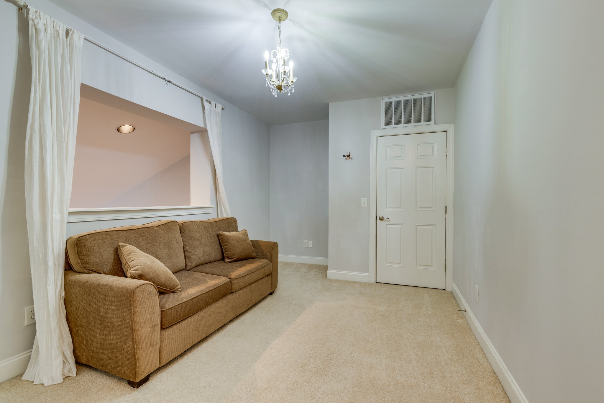 3201 Aspen Grove Drive, Unit F9 Franklin, TN 37067 - Photo 29 of 33 a living room with furniture and a chandelier