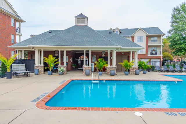 a view of a house with pool porch and chairs