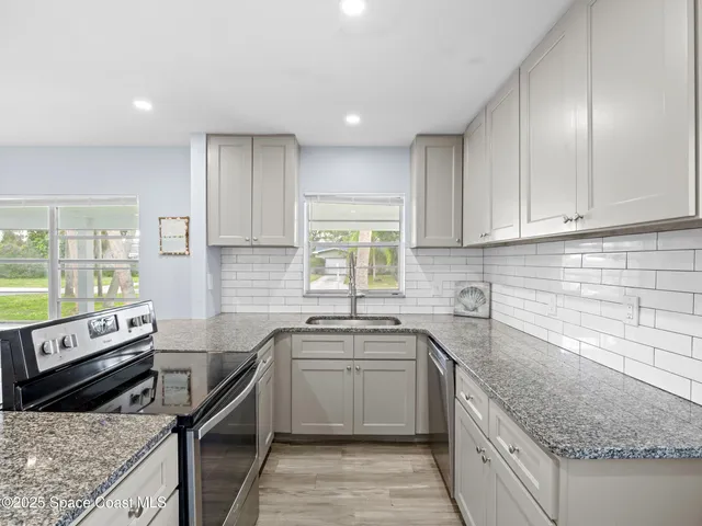 a kitchen with a table and chairs in it