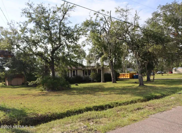 a swimming pool with trees in the background
