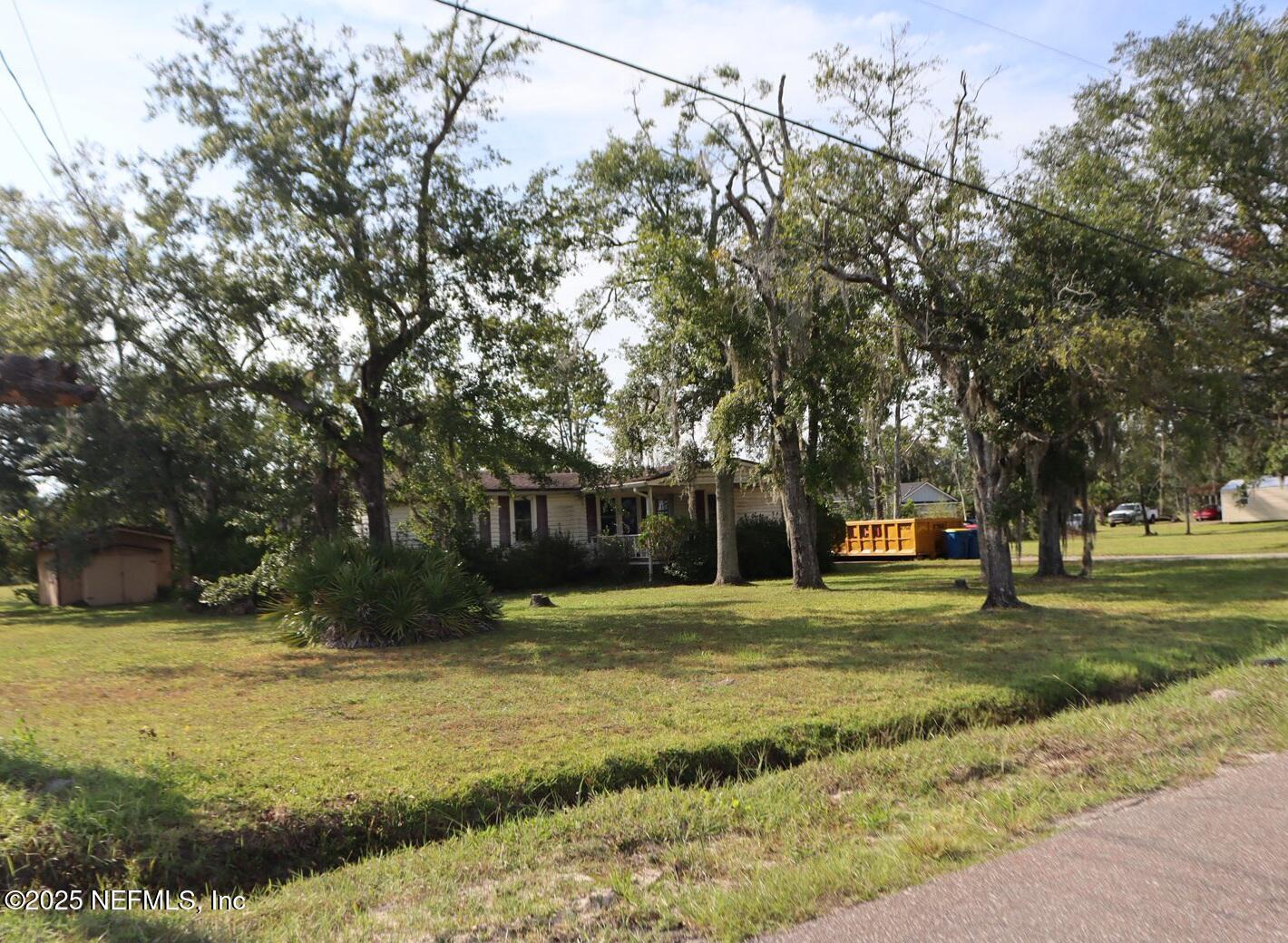 a swimming pool with trees in the background