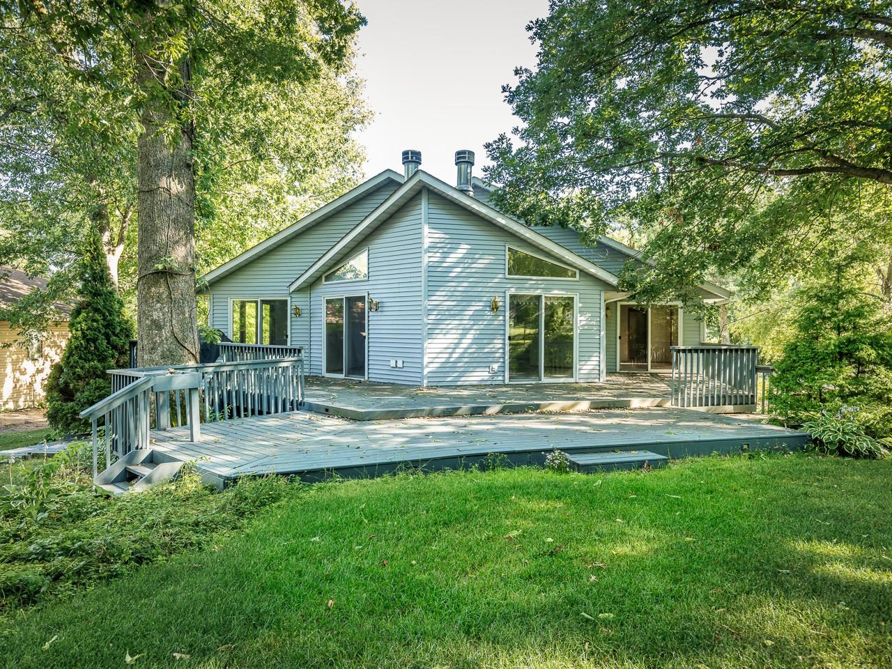 2085 Lake Summerset Road Lake Summerset, IL 61019 - Photo 3 of 32 a front view of house with backyard and outdoor seating