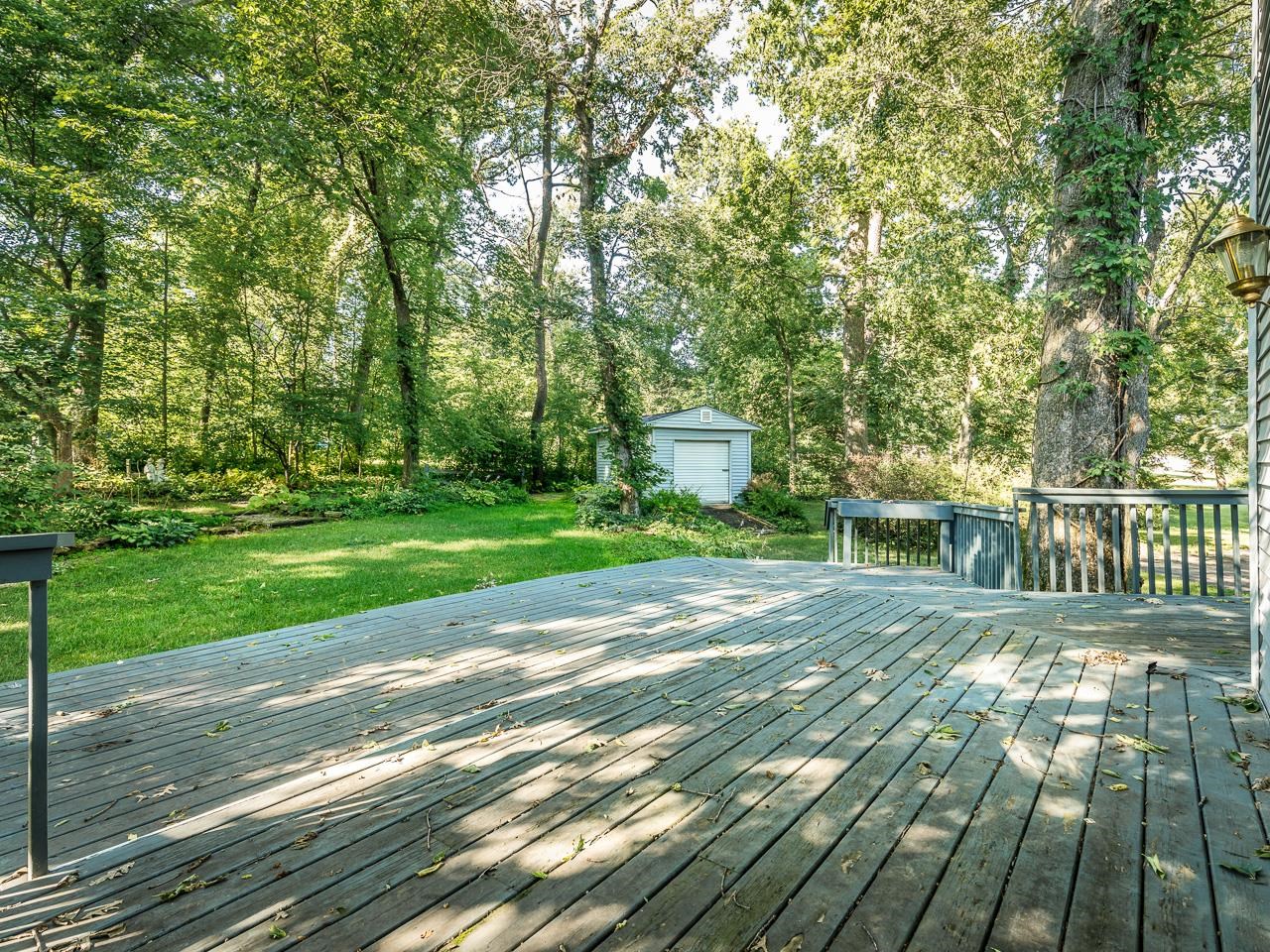 2085 Lake Summerset Road Lake Summerset, IL 61019 - Photo 4 of 32 a view of a house with backyard and a trees