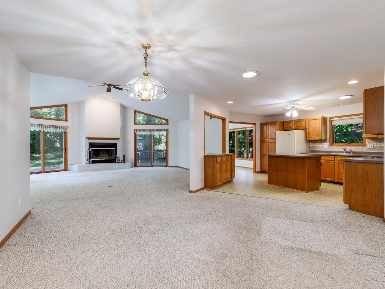 2085 Lake Summerset Road Lake Summerset, IL 61019 - Photo 8 of 32 a view of a big room with windows and a fireplace