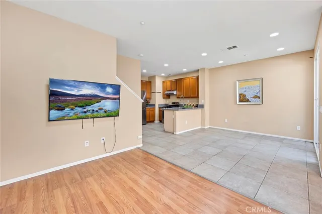 a view of kitchen with kitchen island dining table and chairs