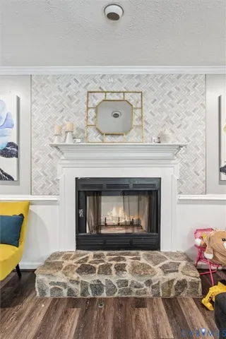 a bedroom with a fireplace and bed