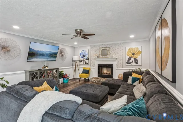 a living room with furniture and a fireplace