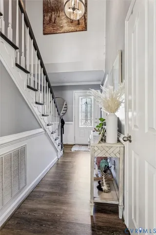 a bathroom with a granite countertop toilet sink and mirror