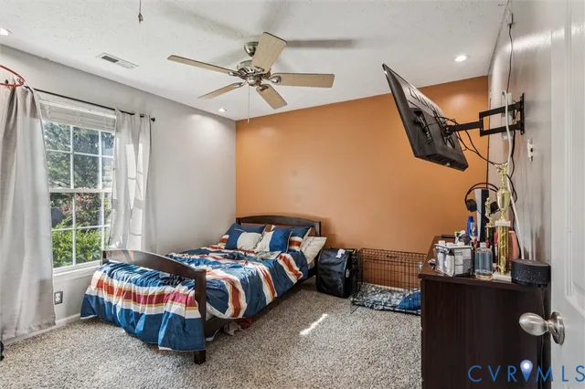 a view of a workspace with furniture and wooden floor